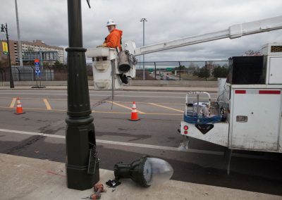 Electrical worker installing new streetlight in Detroit