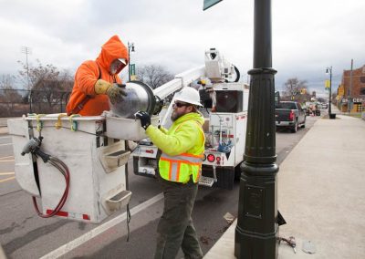 Workers installing new streetlights in Detroit